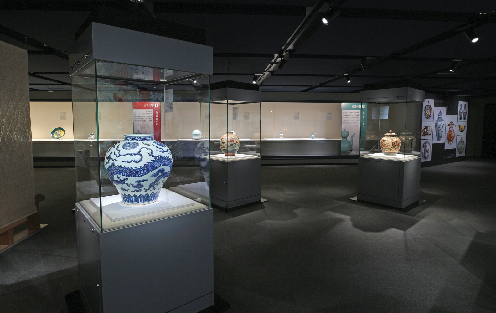 Room in an art museum highlighting an ancient vase with drawings on it