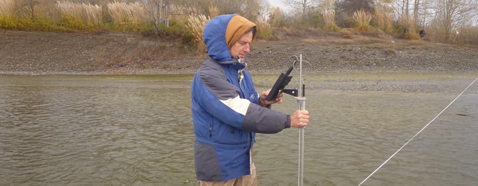 Scott McBain standing in river