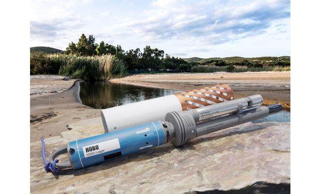 HOBO wireless data logger by water with 2 sensors attached and protective guards