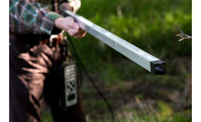 LI-COR PAR light sensor rod held by man measuring scattered sunlight
