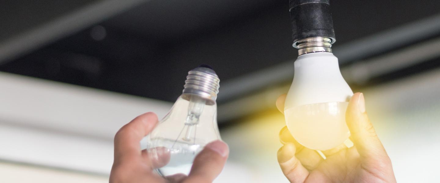 Someone replacing a lightbulb