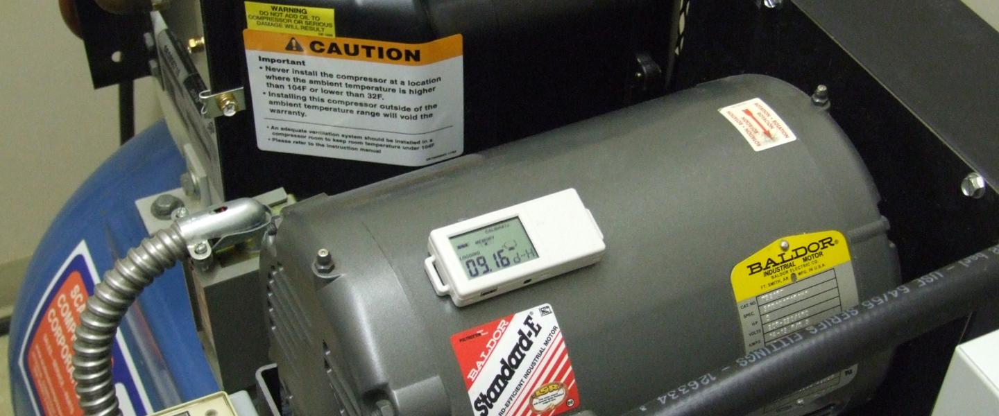 Onset's HOBO UX90-004 Motor On/Off data logger mounted to a compressor motor
