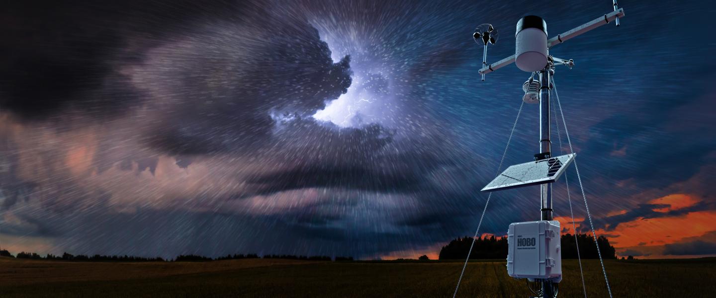 HOBO RX3000 in a farm field during with an ominous sky 