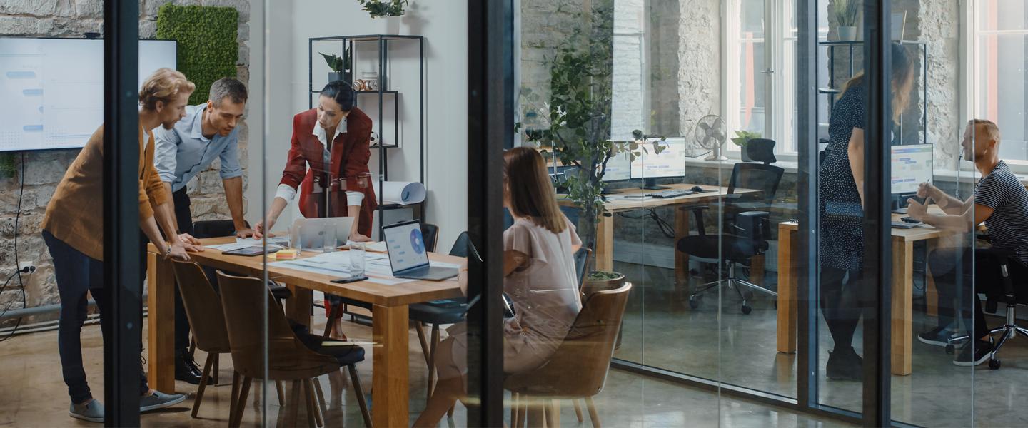 Business meeting in a glassed in room in an office building
