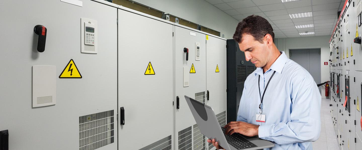 HVAC technician in front of system