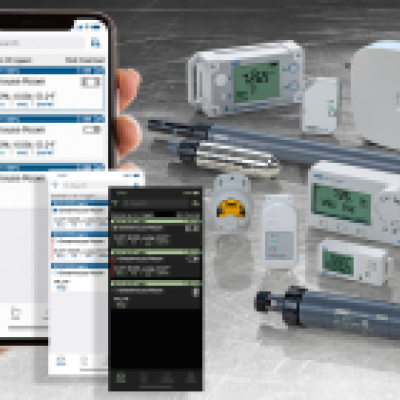 Hand holding mobile device monitoring MX loggers and gateway via Bluetooth